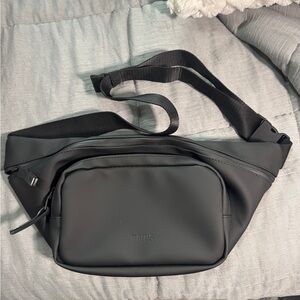 Rains Black Bum Bag. New (no tags). Unisex. Cross sling, fanny pack, hip pack.